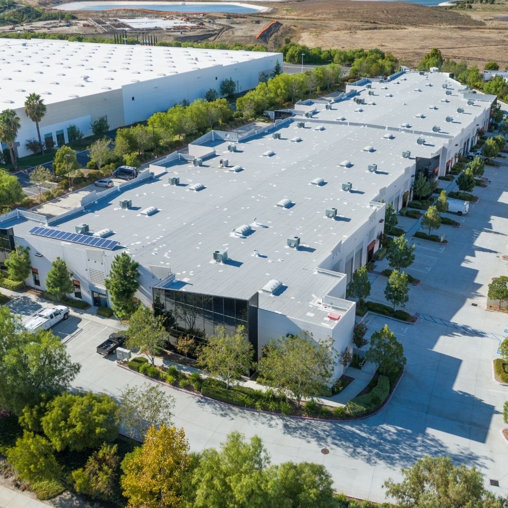 Aerial view of a completed commercial roofing project
